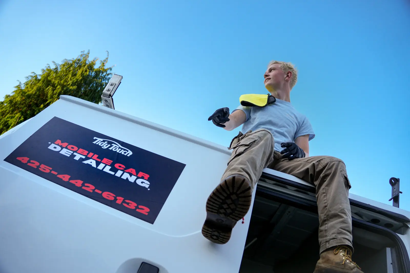 Tidy Touch Mobile Car Detailing van with phone number on the side